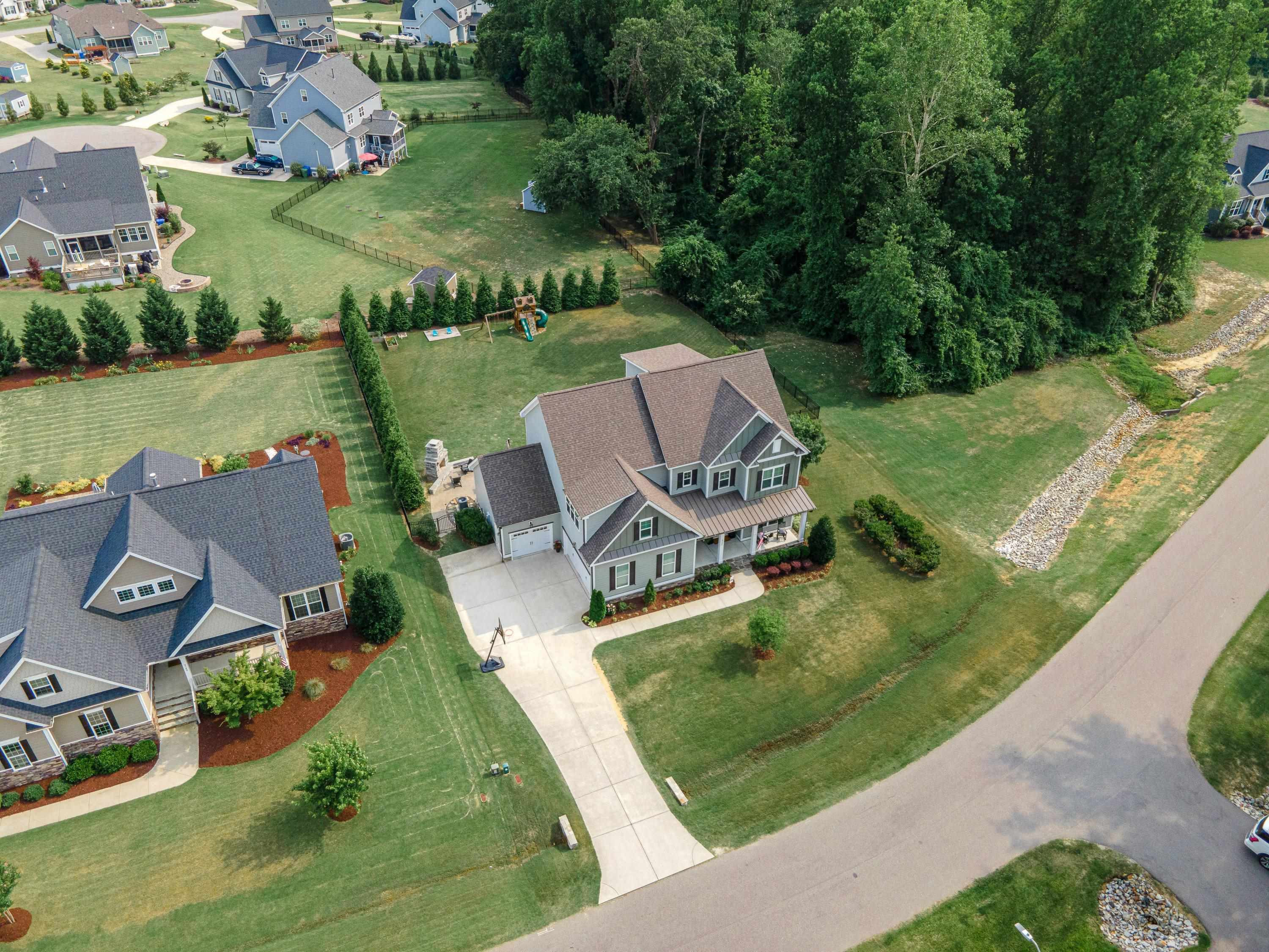 4136 Olde Judd Drive Willow Spring, NC 27592 - Photo 46 of 47 an aerial view of a house with garden space and lake view