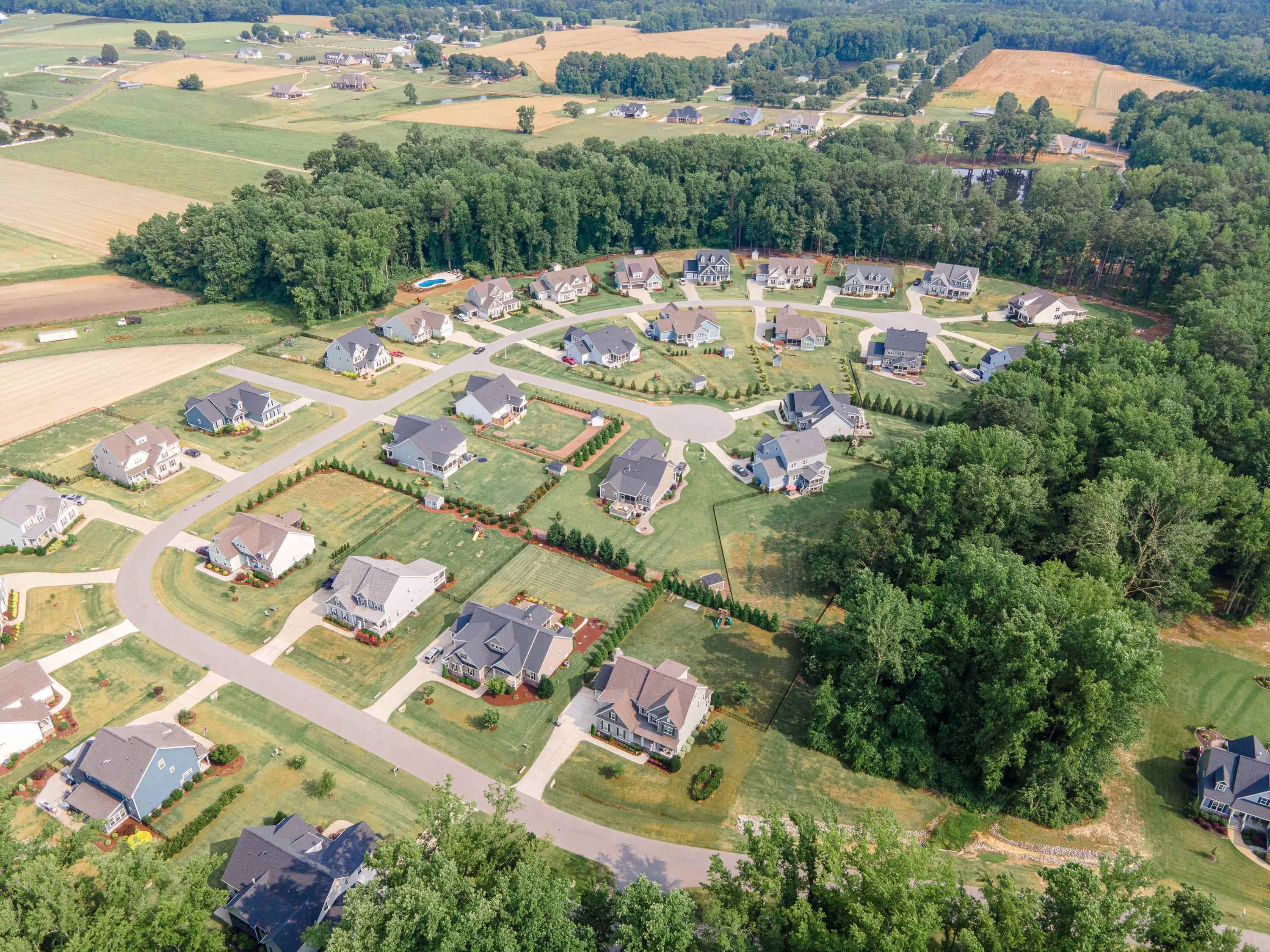 4136 Olde Judd Drive Willow Spring, NC 27592 - Photo 47 of 47 an aerial view of a house with a garden