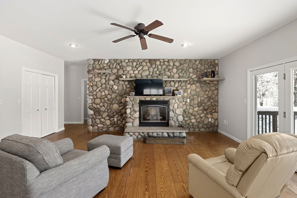 95 Wright Road Hollis, NH 03049 - Photo 11 of 42 a living room with furniture and a fireplace