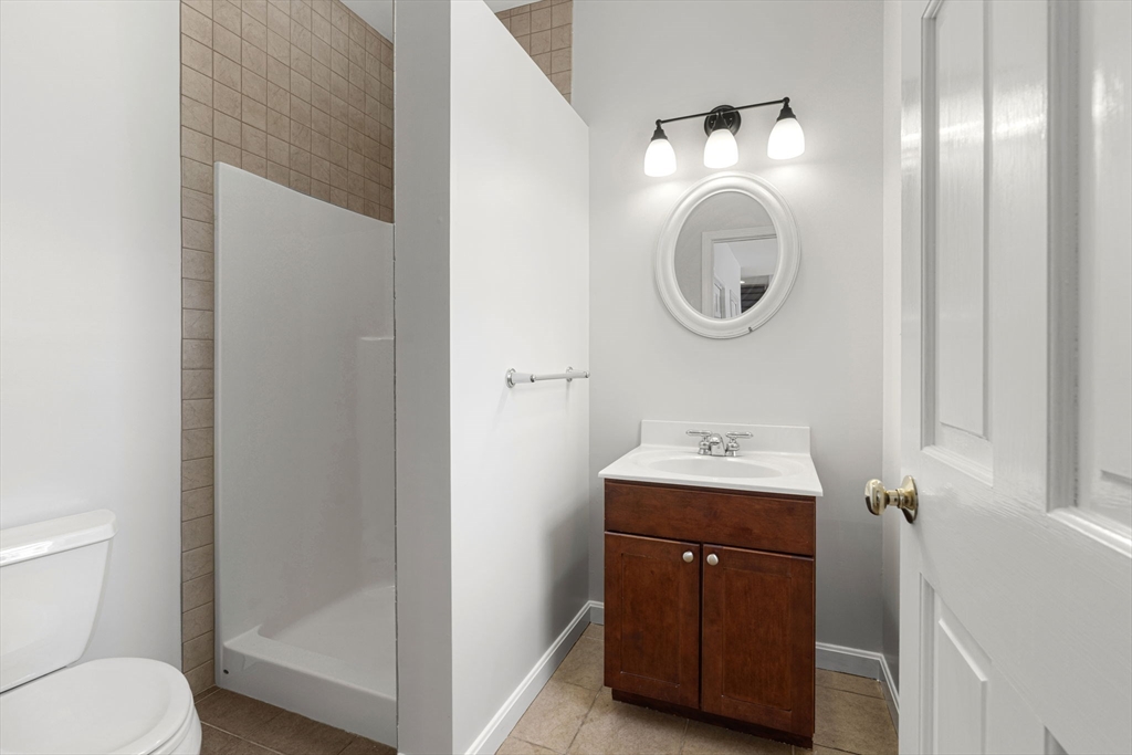 95 Wright Road Hollis, NH 03049 - Photo 15 of 42 a bathroom with a toilet a sink and a mirror