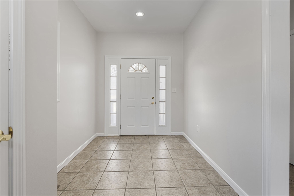 95 Wright Road Hollis, NH 03049 - Photo 18 of 42 an empty room with wooden floor and mirror