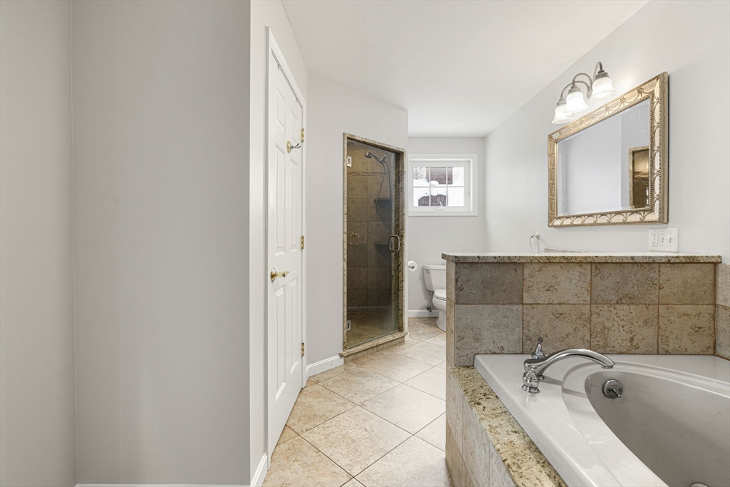 95 Wright Road Hollis, NH 03049 - Photo 24 of 42 a bathroom with a tub sink and mirror