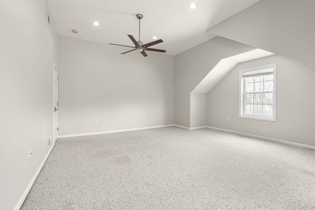 95 Wright Road Hollis, NH 03049 - Photo 29 of 42 an empty room with windows and fan