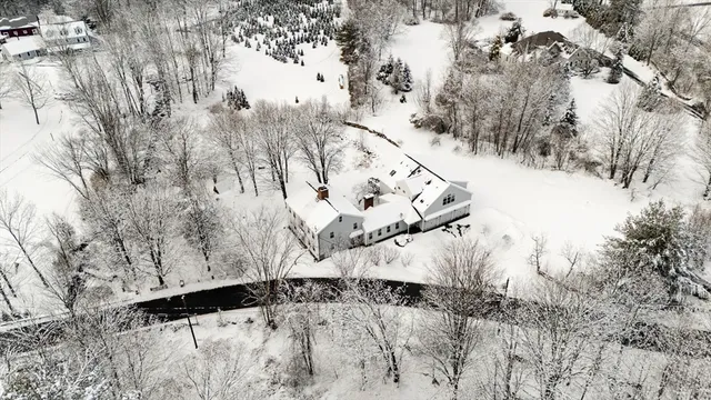a view of snow on the road