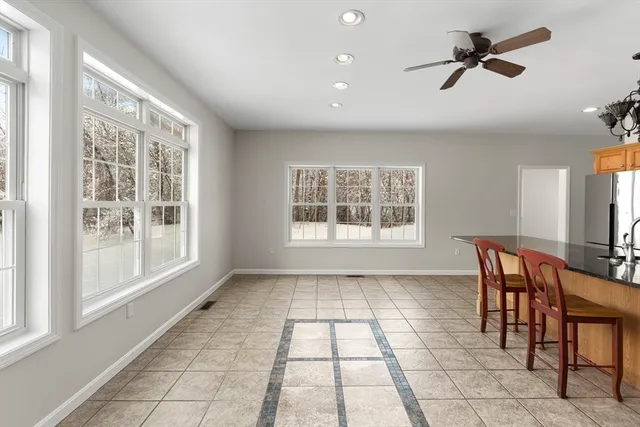 a view of a dining room with furniture window and outside view