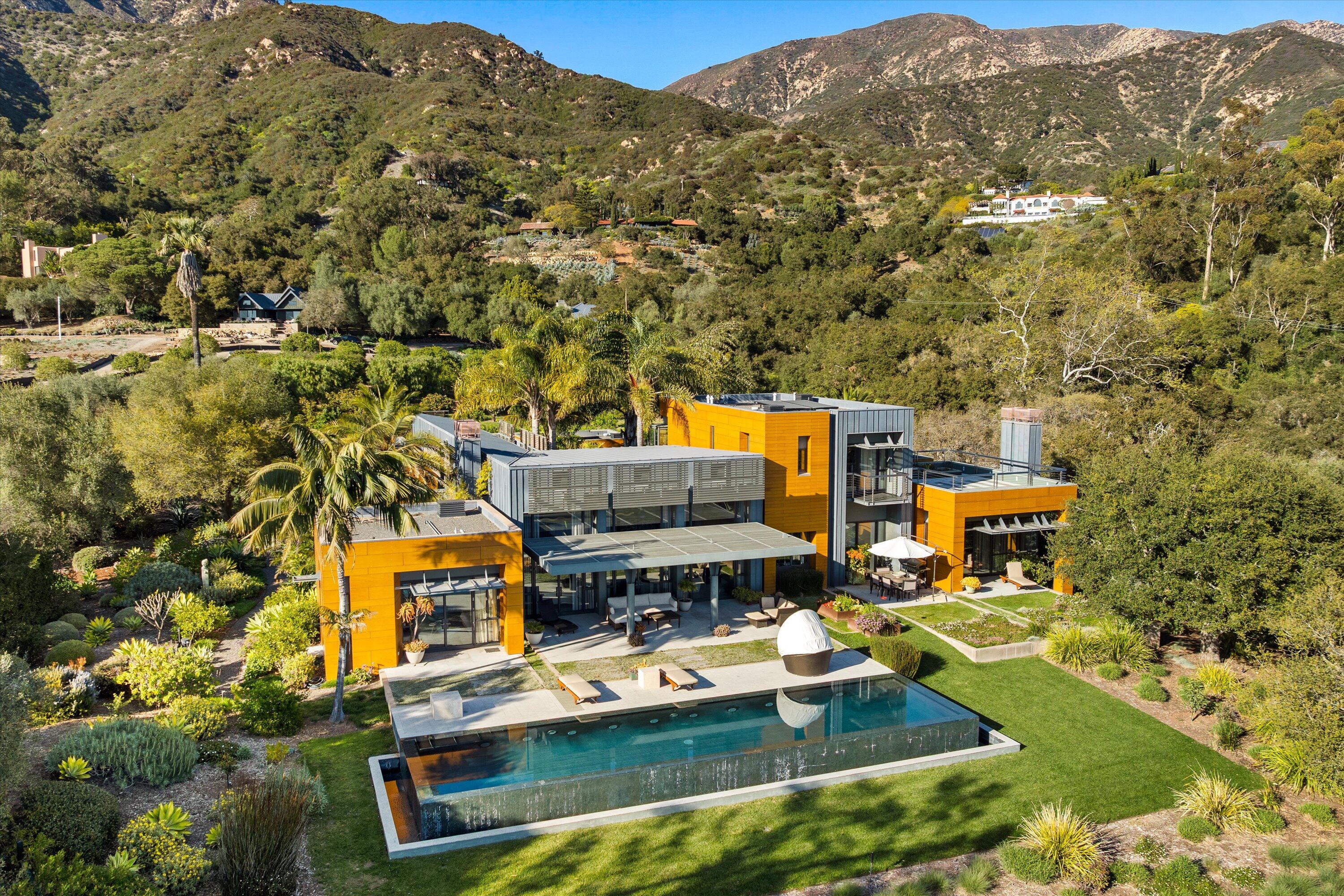 an aerial view of a house with a garden