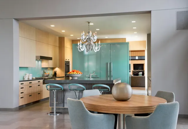 a view of a dining room with furniture and chandelier