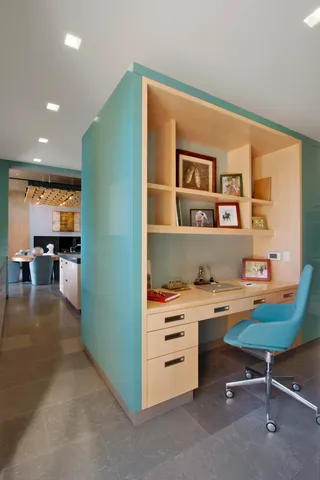 a workspace with furniture and window