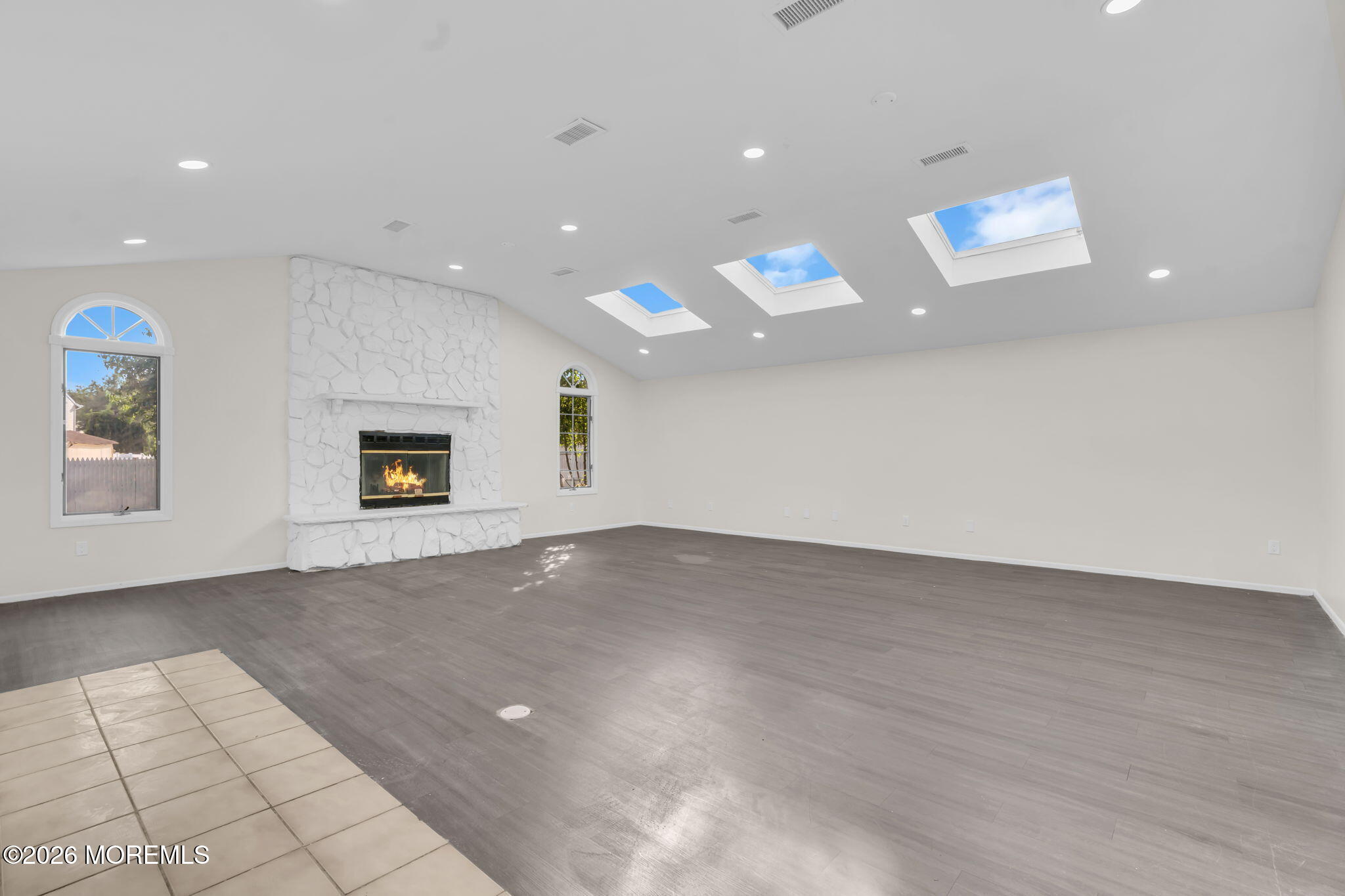45 Peachstone Road Howell, NJ 07731 - Photo 17 of 54 an empty room with windows and fireplace