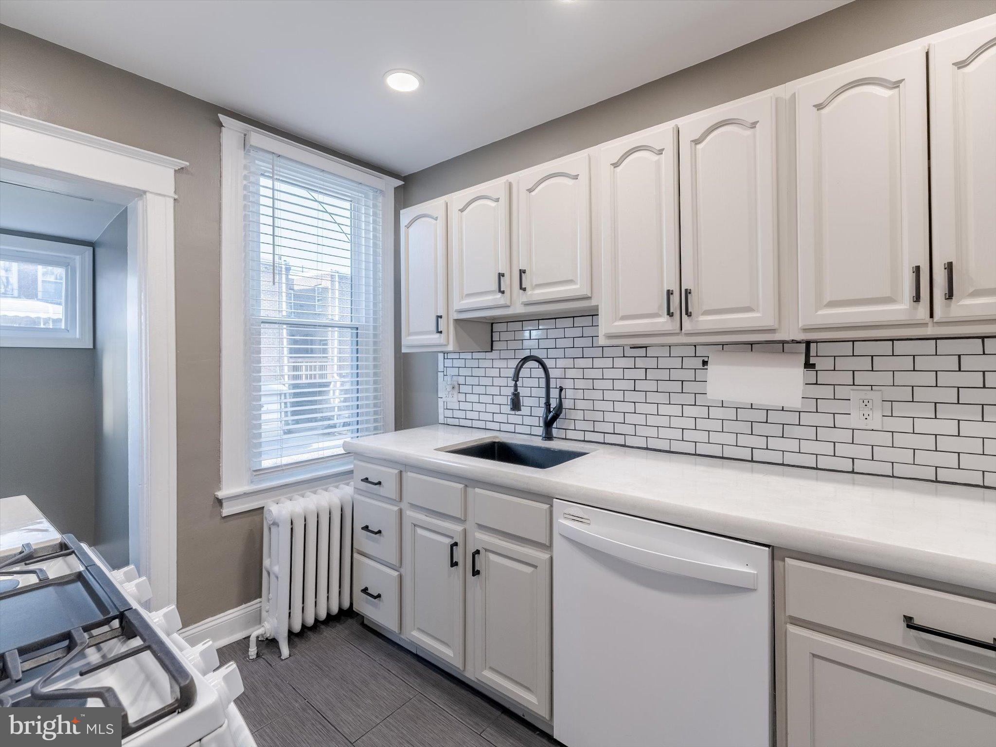 321 East Phil Ellena Street Philadelphia, PA 19119 - Photo 14 of 39 Modern kitchen with sleek finishes.