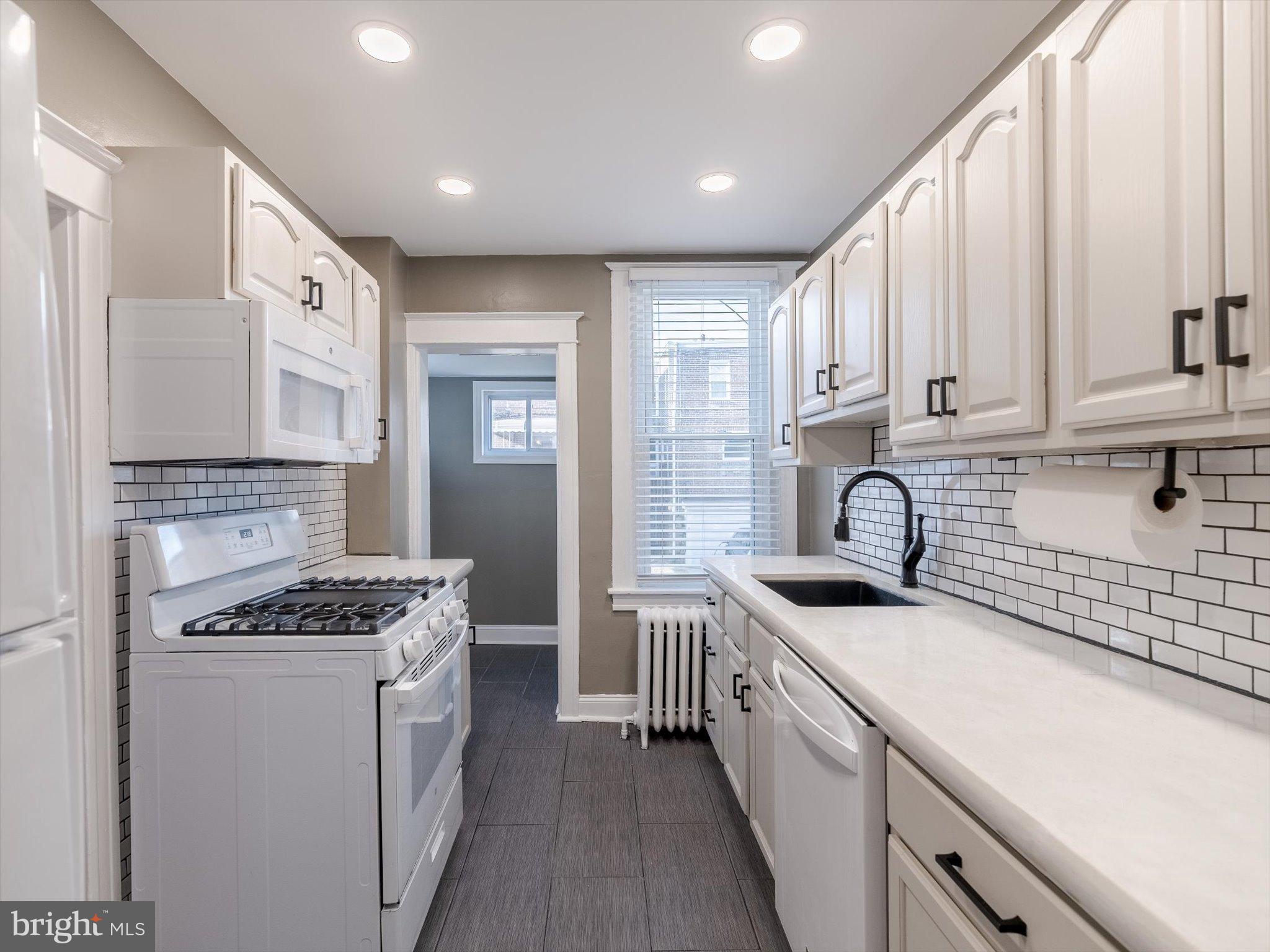321 East Phil Ellena Street Philadelphia, PA 19119 - Photo 15 of 39 Bright and modern kitchen with classic charm.