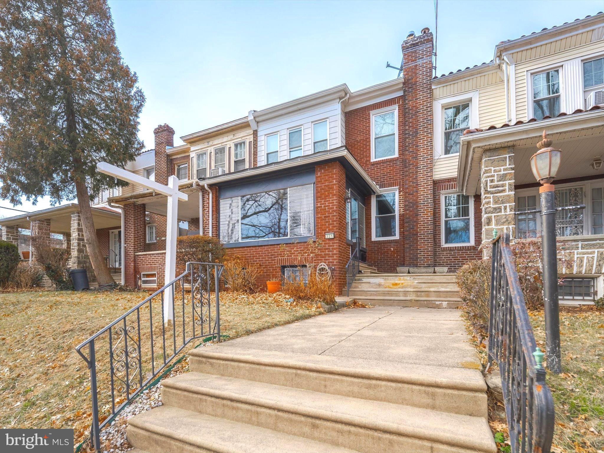 321 East Phil Ellena Street Philadelphia, PA 19119 - Photo 2 of 39 Charming brick facade with inviting entrance.