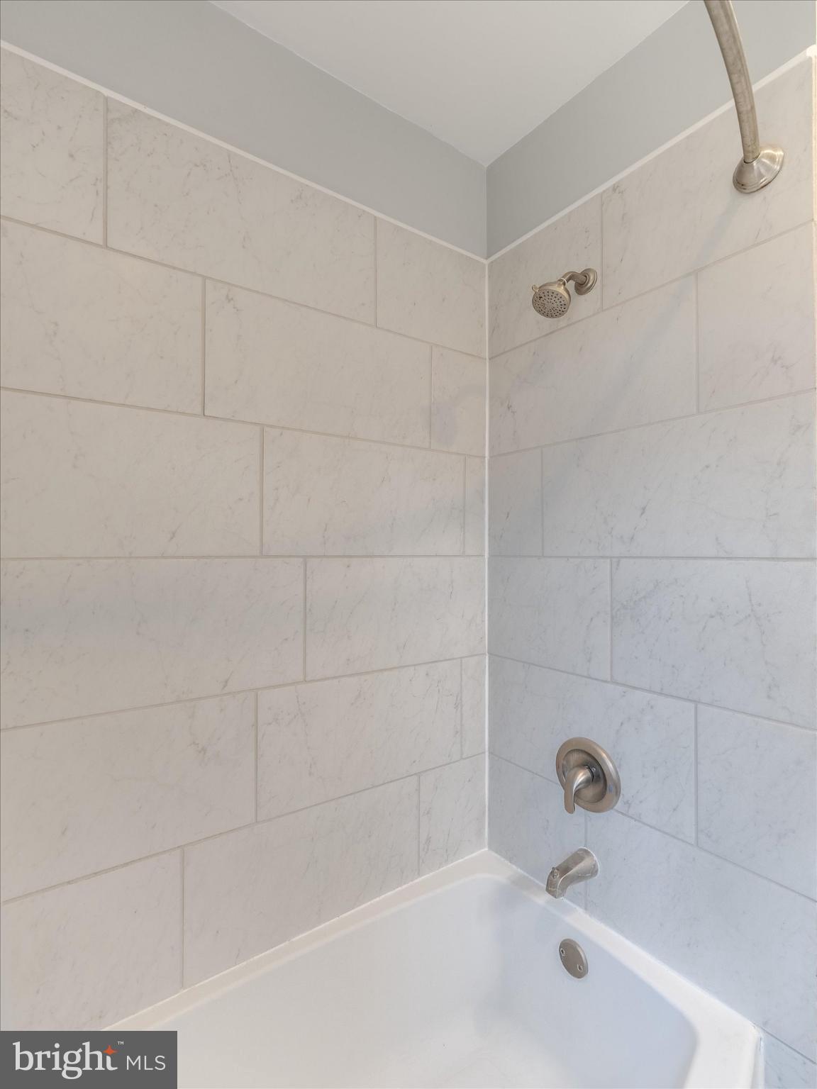 321 East Phil Ellena Street Philadelphia, PA 19119 - Photo 23 of 39 Sleek, modern shower with elegant tiles.