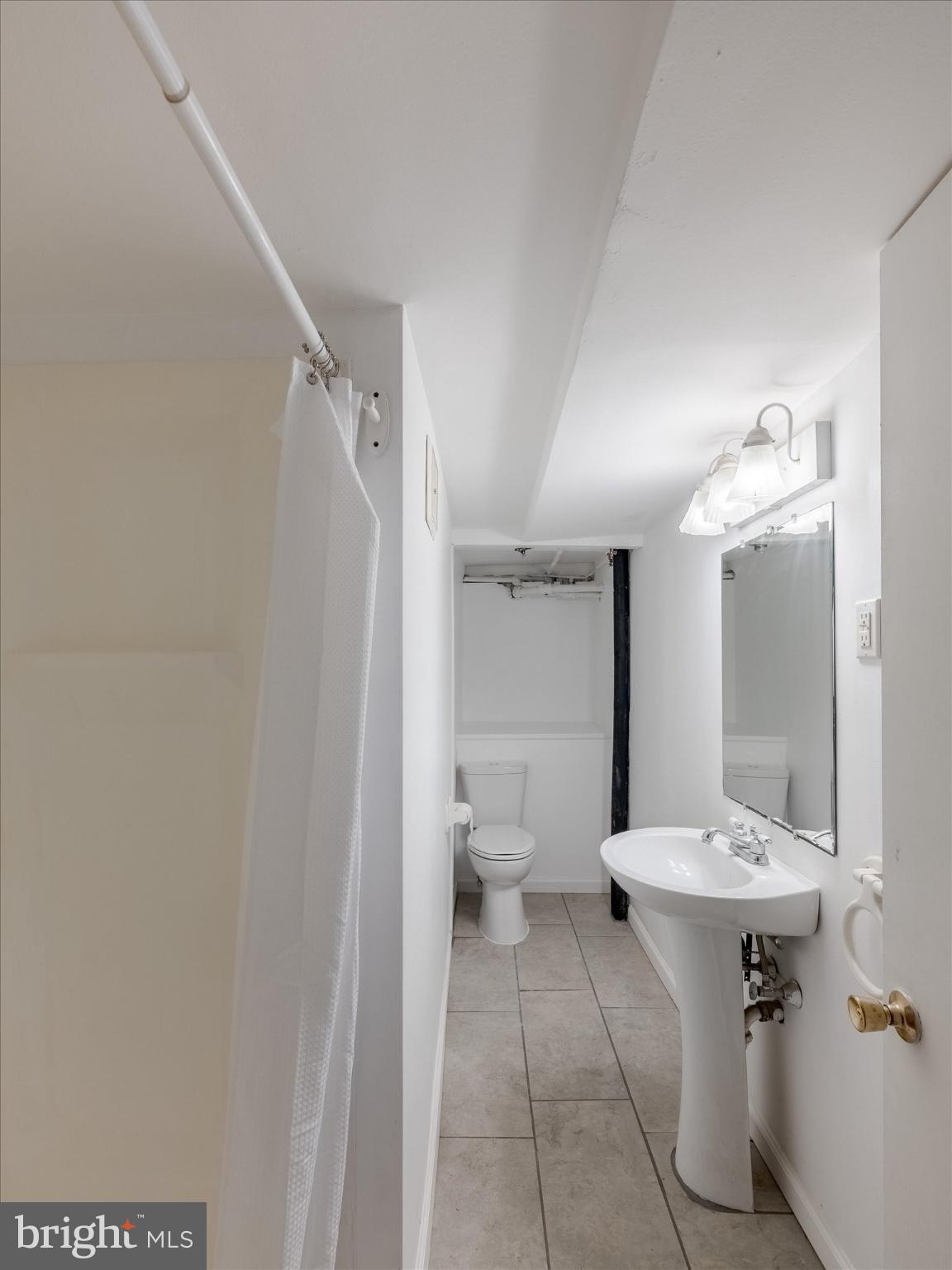 321 East Phil Ellena Street Philadelphia, PA 19119 - Photo 35 of 39 Bright and functional bathroom space.