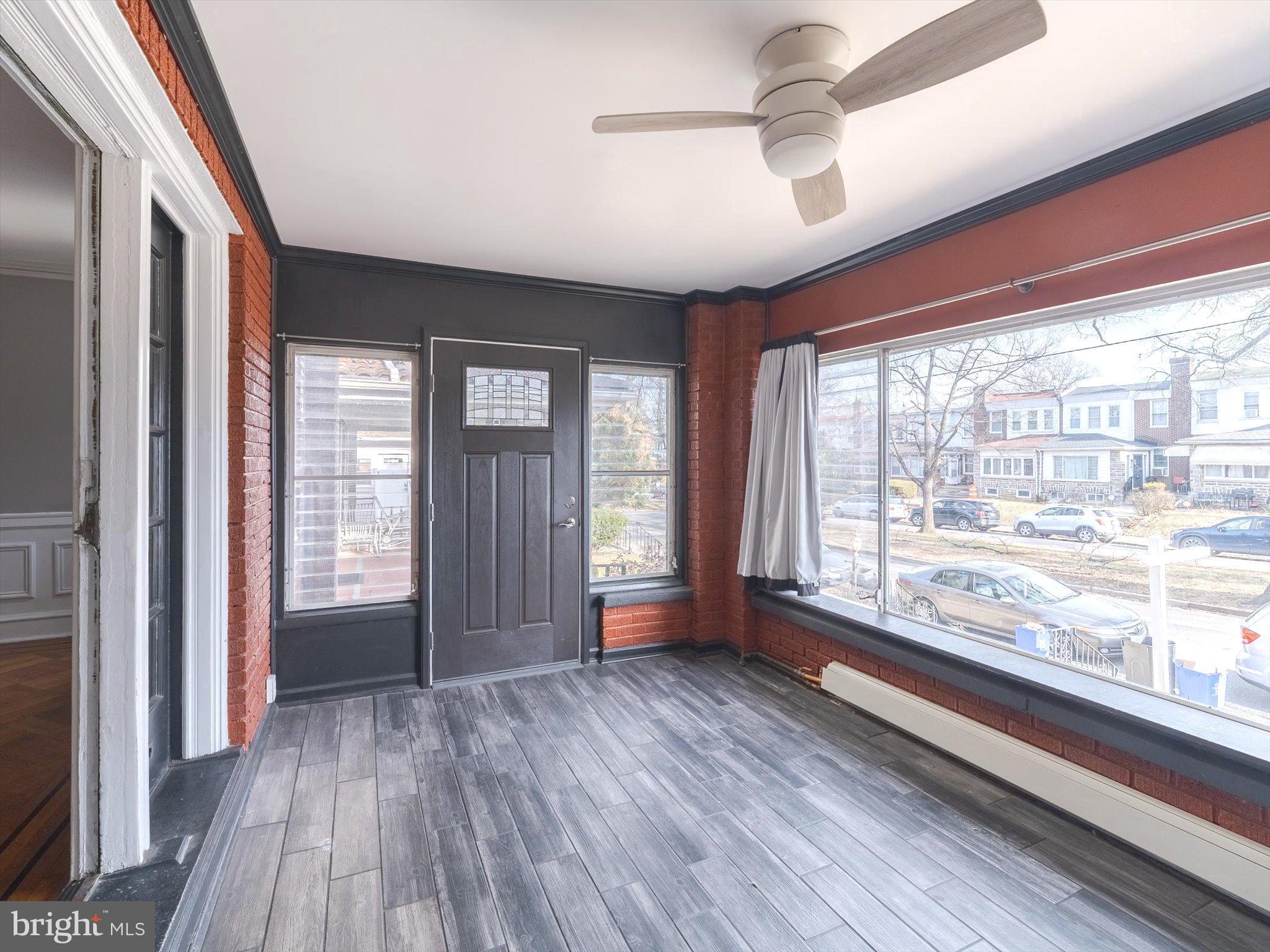 321 East Phil Ellena Street Philadelphia, PA 19119 - Photo 7 of 39 Bright and inviting sunroom with classic charm.