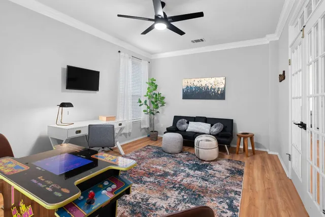 a living room with furniture and a flat screen tv