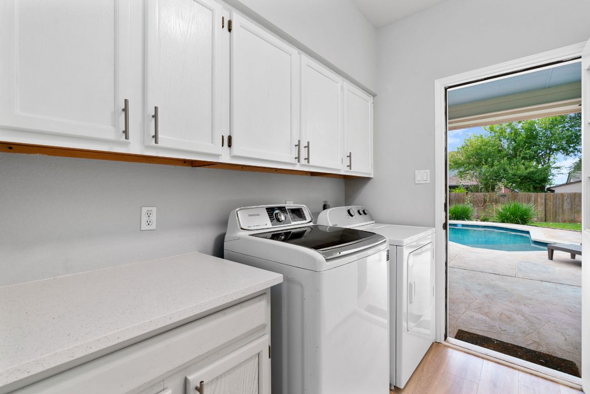 807 Clarence Bohl Pflugerville, TX 78660 - Photo 35 of 40 a kitchen with a cabinets and white view of the sink
