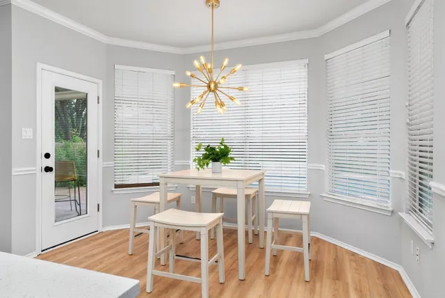 a dining room with furniture and window