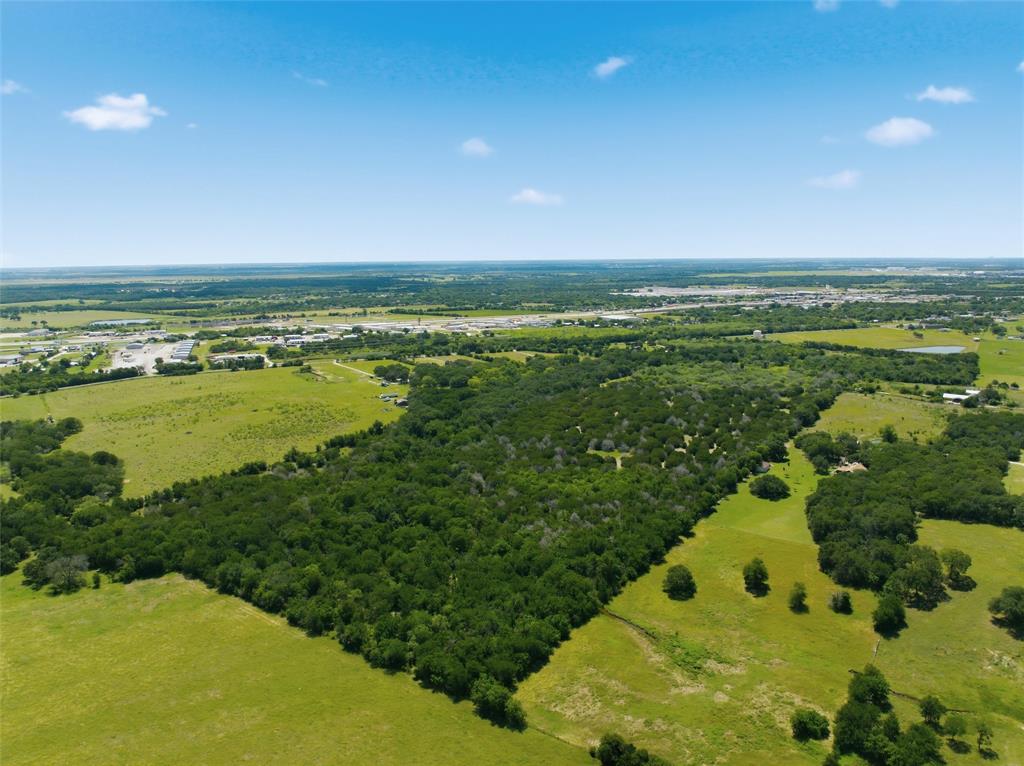 663 North Katy Road Elm Mott, TX 76640 - Photo 24 of 25 Sprawling acreage featuring significant tree coverage and open grassland