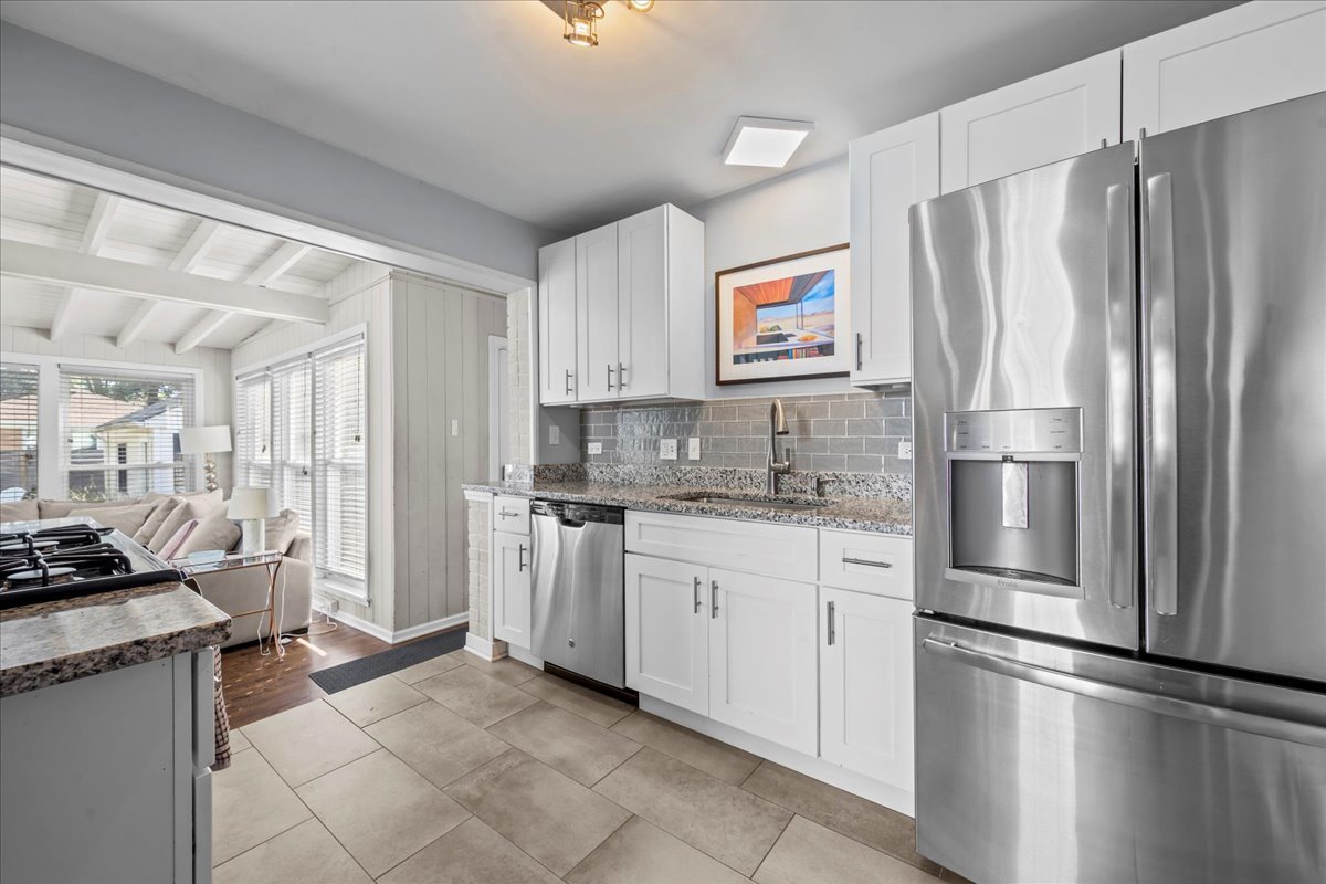 1425 Brophy Avenue Park Ridge, IL 60068 - Photo 6 of 24 a kitchen with stainless steel appliances granite countertop a refrigerator sink and stove
