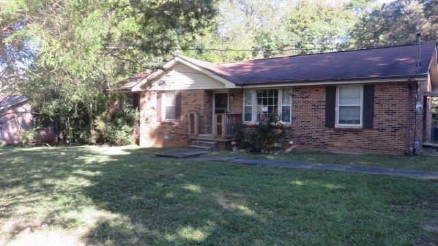 325 Dean Road Clarksville, TN 37040 - Photo 1 of 11 a front view of a house with a yard