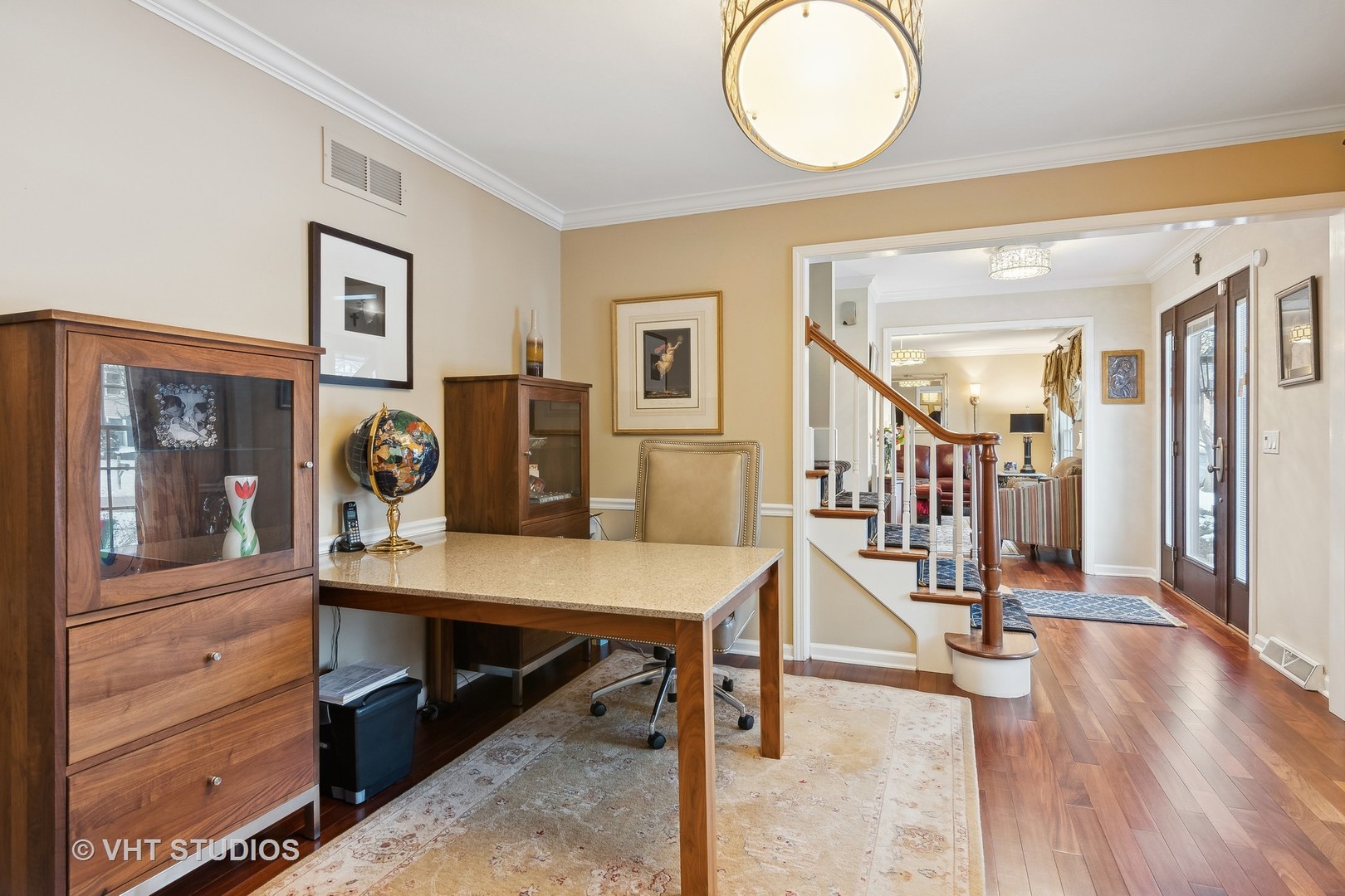68 Citation Circle Wheaton, IL 60189 - Photo 12 of 38 a view of a room with lots of frames and wooden floor