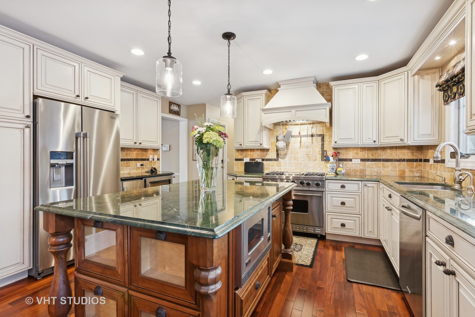 68 Citation Circle Wheaton, IL 60189 - Photo 6 of 38 a kitchen with stainless steel appliances granite countertop a stove refrigerator and cabinets