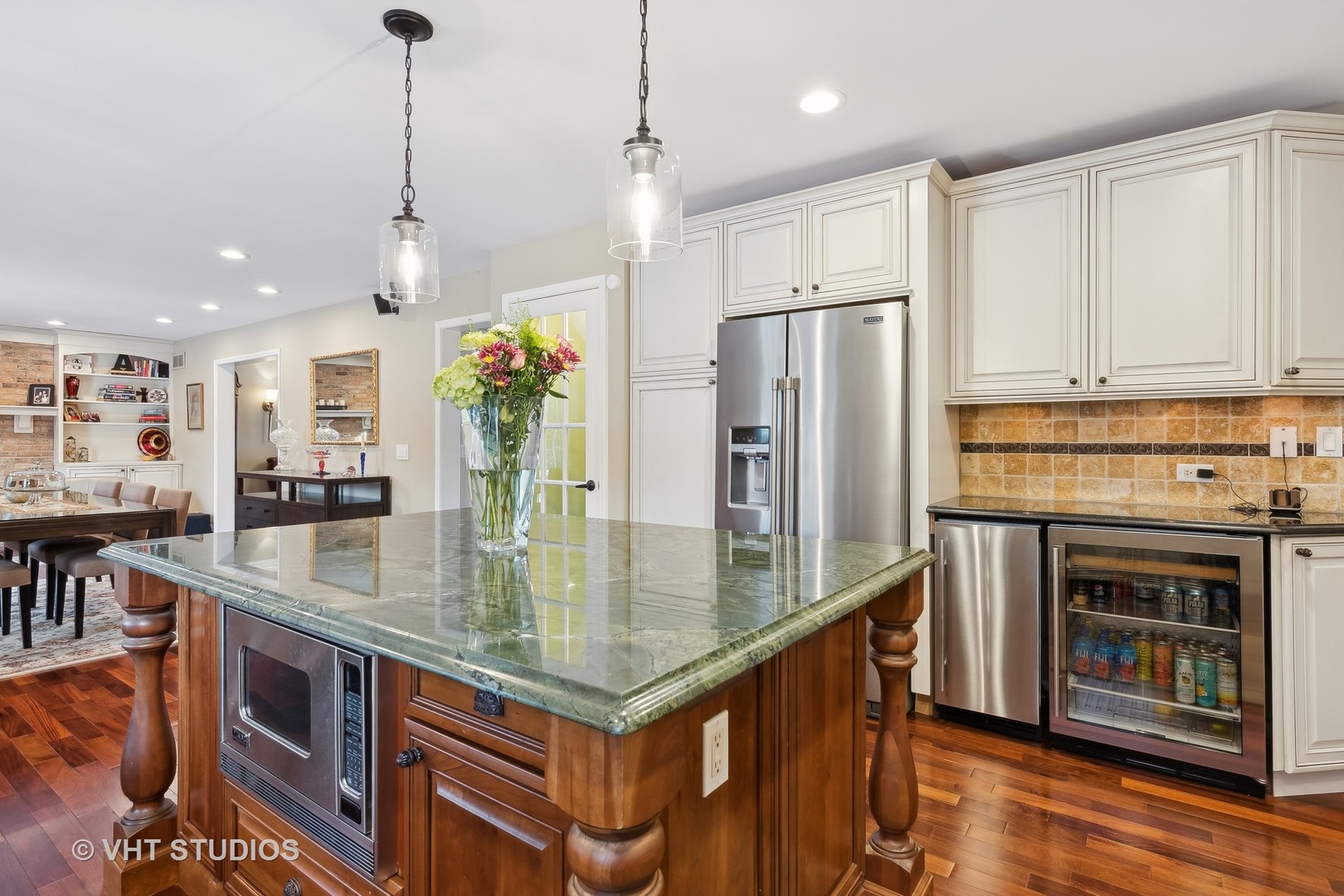 68 Citation Circle Wheaton, IL 60189 - Photo 7 of 38 a kitchen with stainless steel appliances granite countertop a stove refrigerator and a center island
