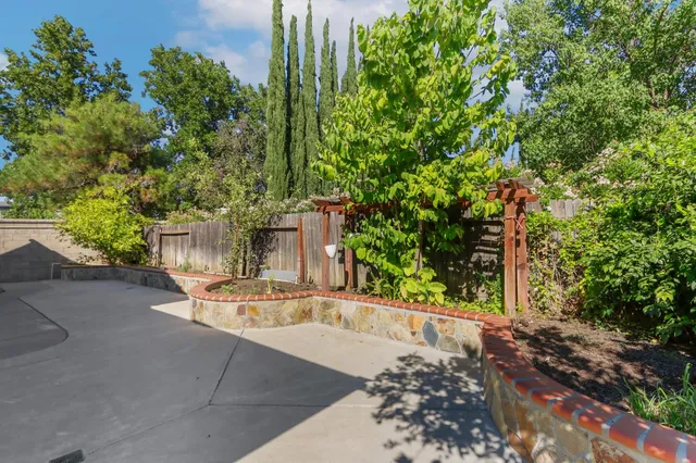 a kitchen with stainless steel appliances a refrigerator and a stove top oven