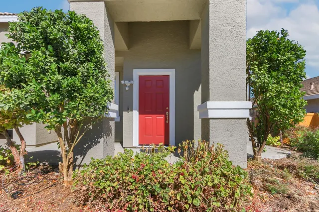 front view of a house with a yard