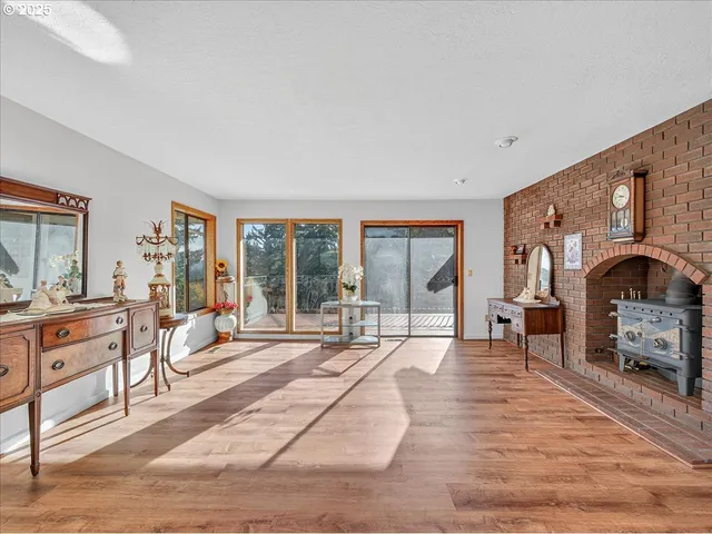 a living room with furniture a table and a large window