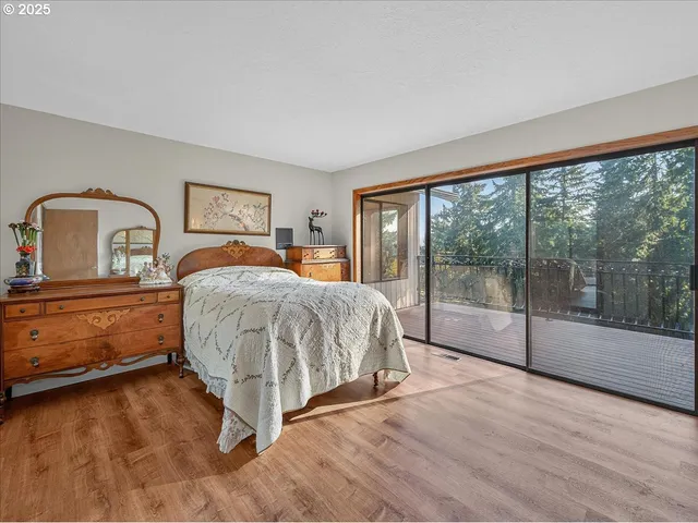 a view of a room with wooden floor and iron stairs