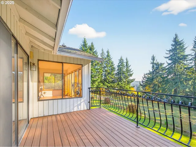 a balcony view with a backyard