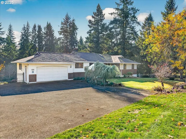 a front view of a house with a yard table and chairs