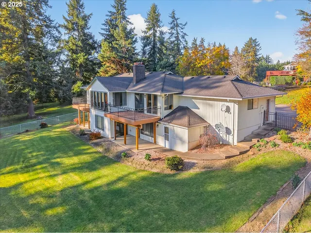 a front view of a house with a yard table and chairs