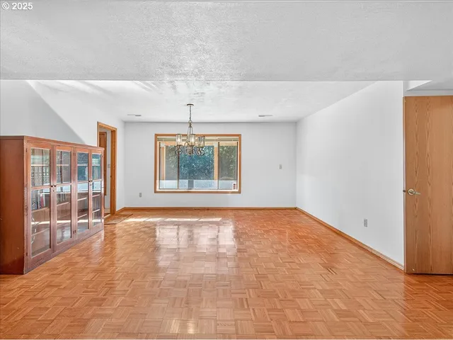 a spacious bedroom with a large bed and a flat screen tv