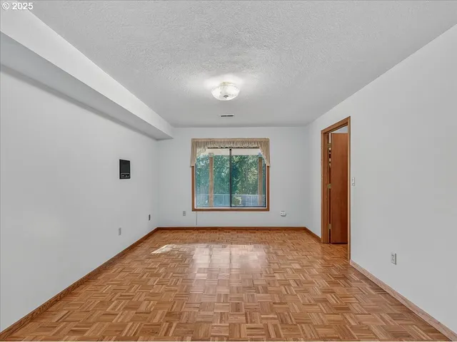 a bathroom with a granite countertop sink toilet a mirror and shower
