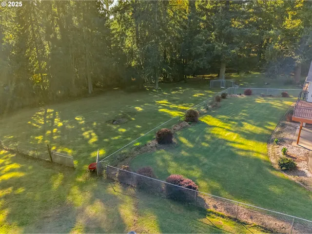 a picture of a room with a white wall and a refrigerator