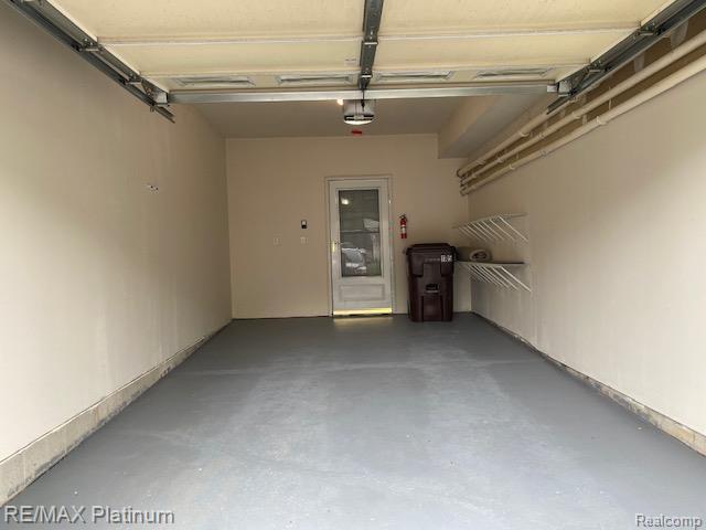 1105 Rial Lake Drive, Unit 45 Howell, MI 48843 - Photo 19 of 19 Garage with garage door opener.