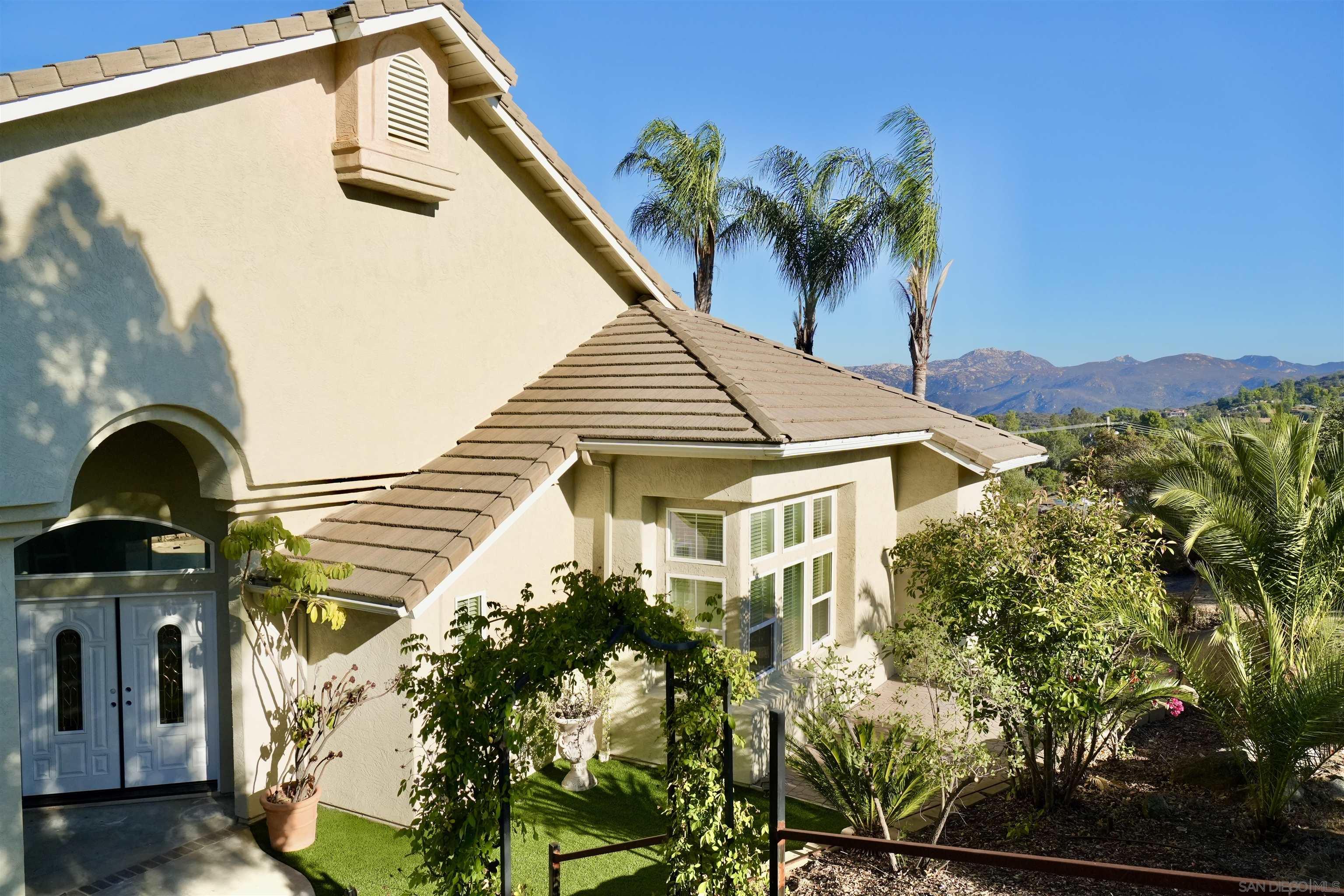 2625 Rancho Sierra Alpine, CA 91901 - Photo 4 of 28 a view of a house with a flower garden