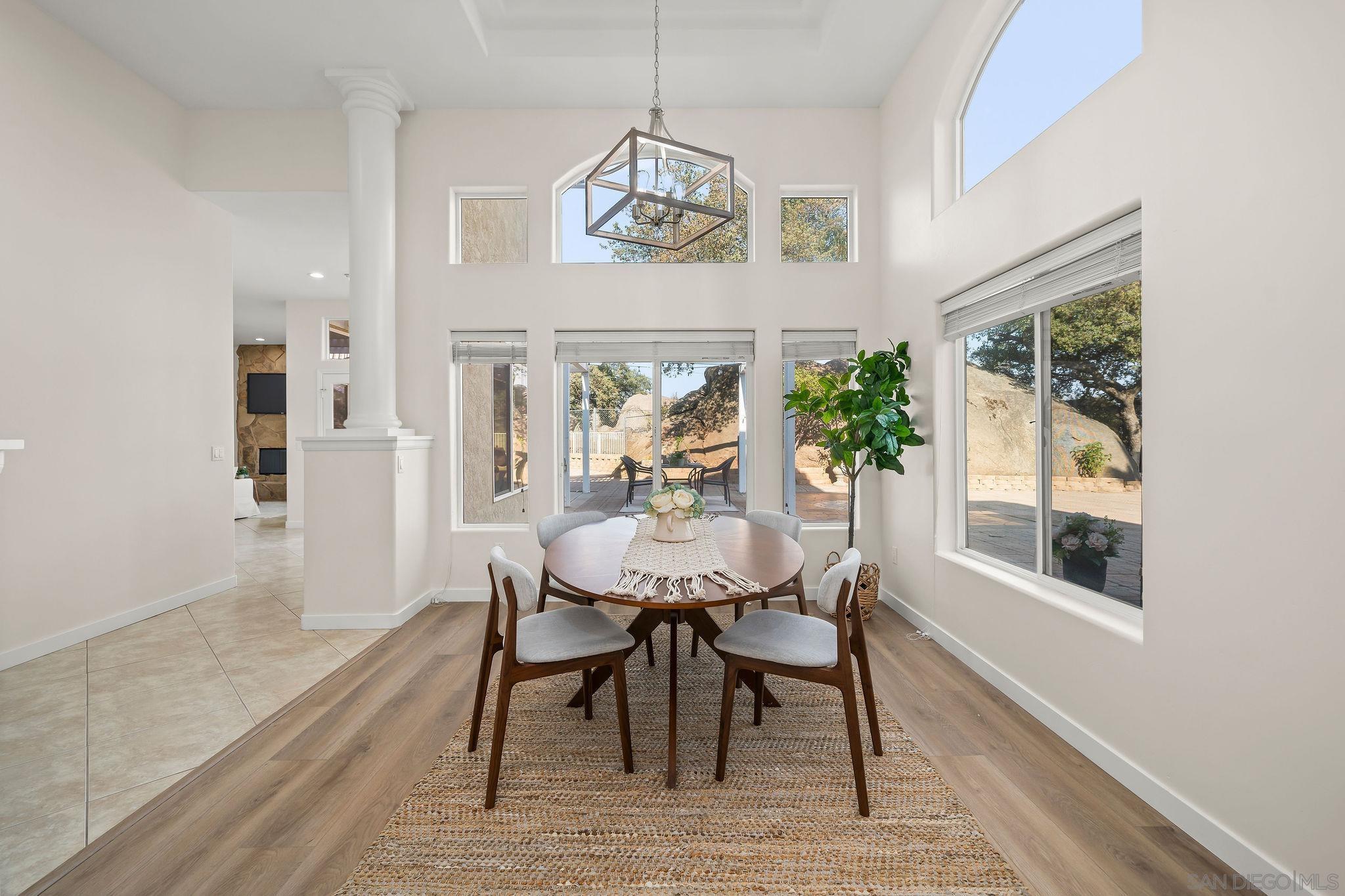 2625 Rancho Sierra Alpine, CA 91901 - Photo 7 of 28 a view of a dining room with furniture window and wooden floor