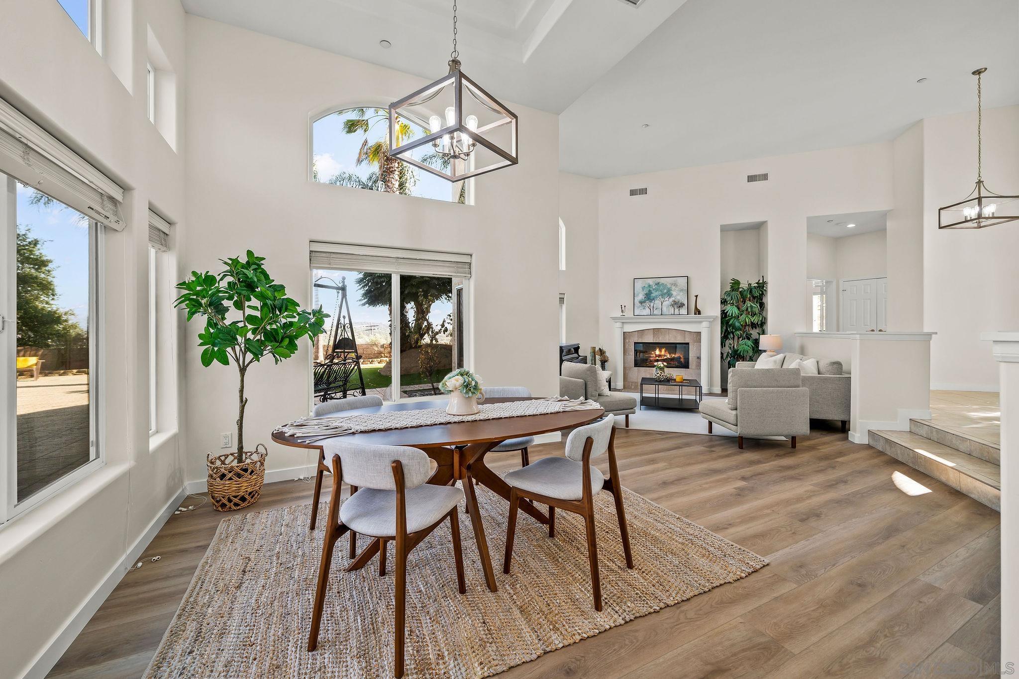 2625 Rancho Sierra Alpine, CA 91901 - Photo 8 of 28 a view of a dining room with furniture a livingroom and chandelier