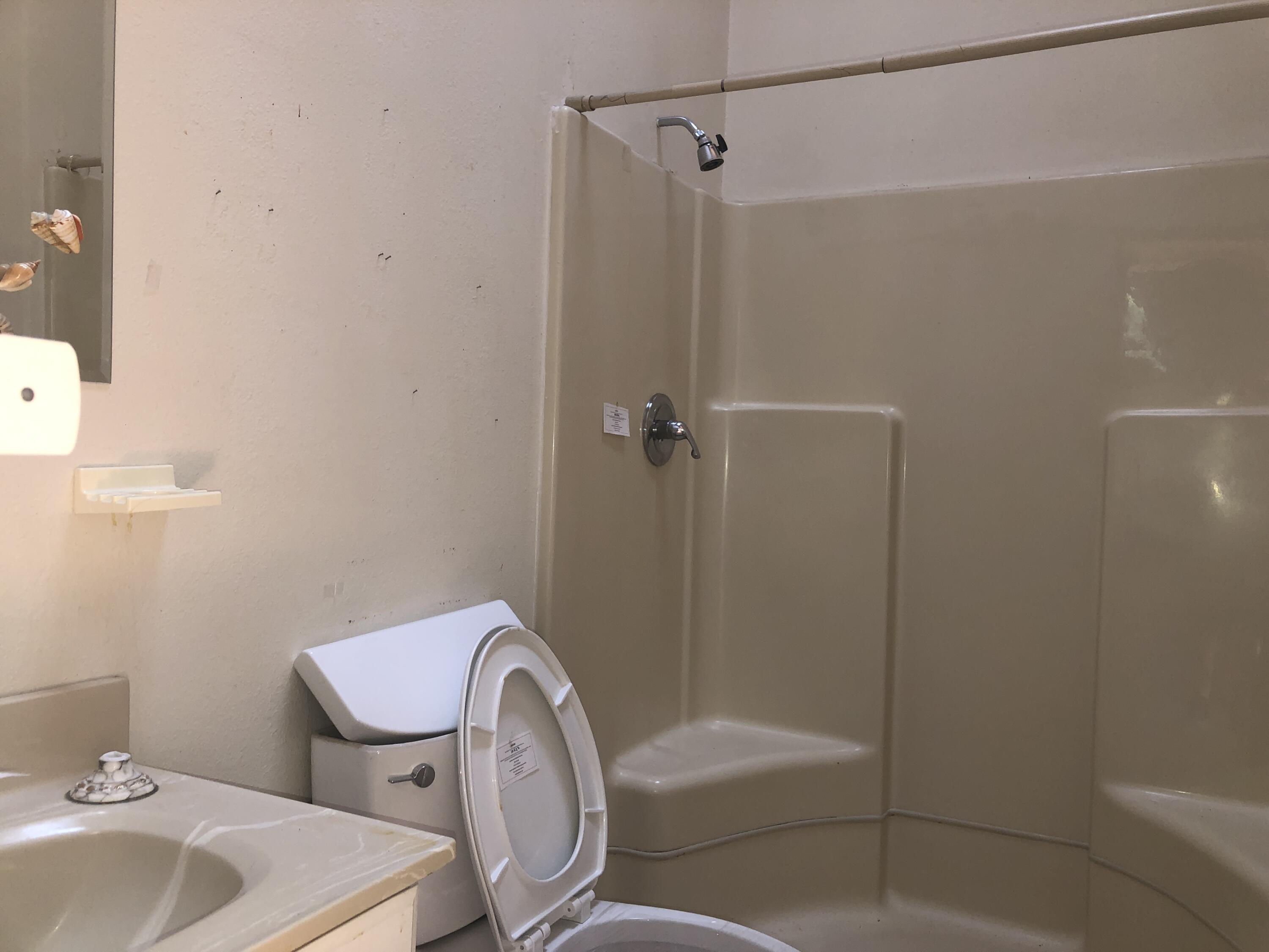 25360 Cedar Glen Drive Idyllwild, CA 92549 - Photo 12 of 47 a bathroom with a sink toilet and shower