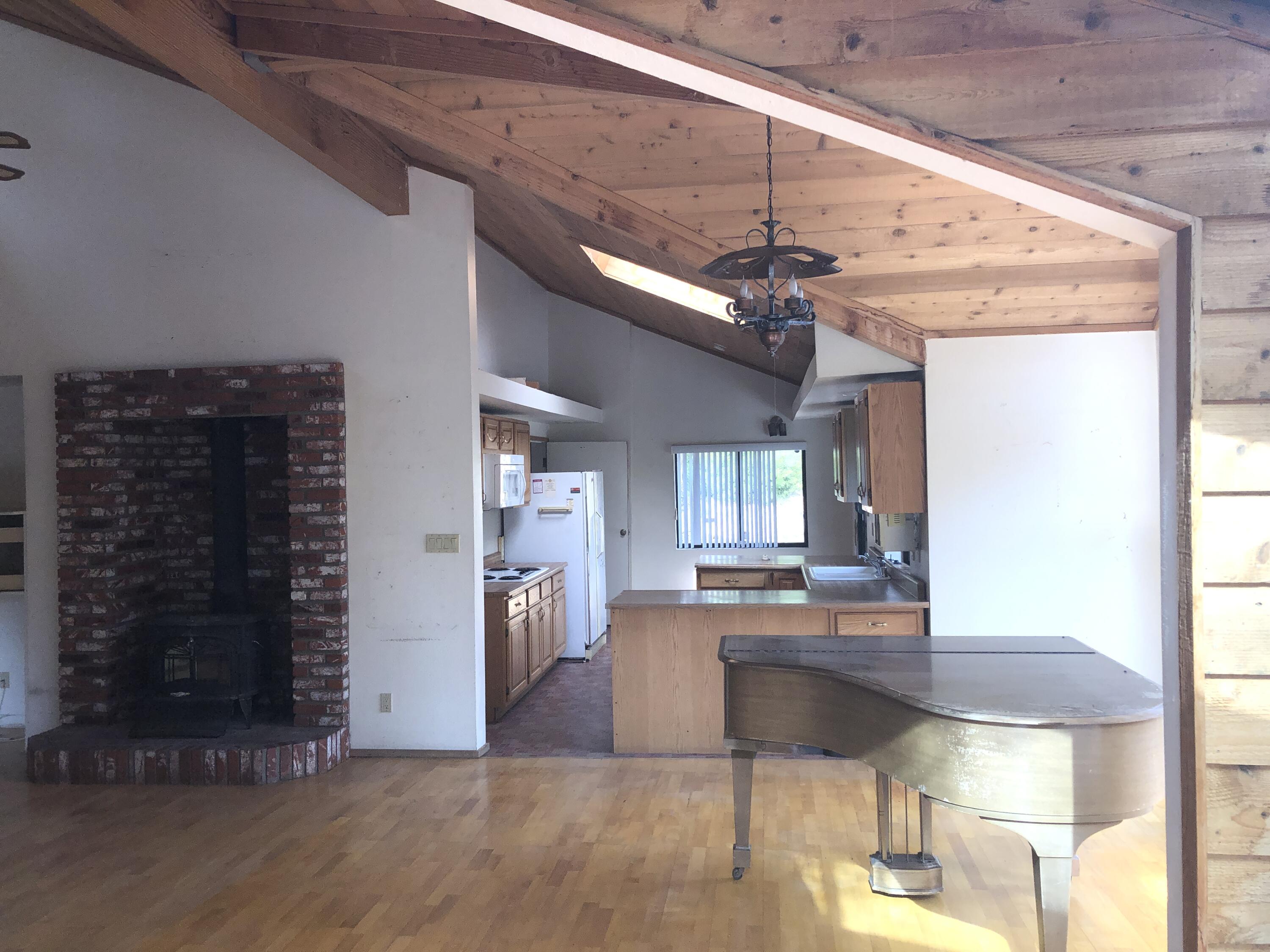 25360 Cedar Glen Drive Idyllwild, CA 92549 - Photo 19 of 47 a kitchen with kitchen island granite countertop a stove and a refrigerator