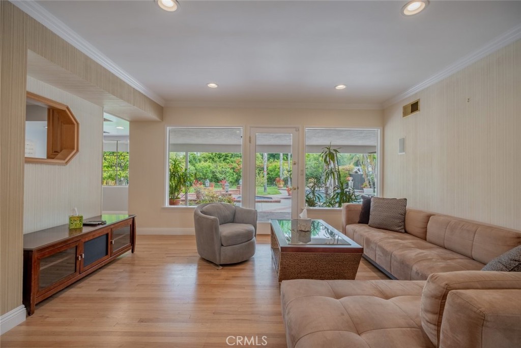 15363 Victory Boulevard Van Nuys, CA 91406 - Photo 11 of 52 a living room with furniture and a large window