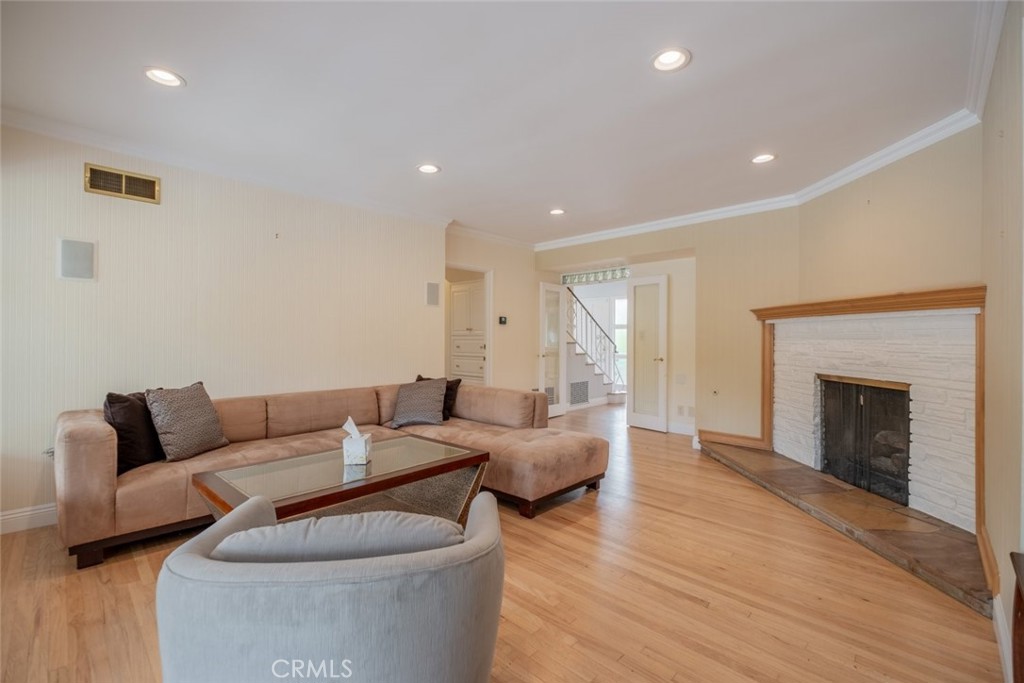 15363 Victory Boulevard Van Nuys, CA 91406 - Photo 12 of 52 a living room with furniture and a fireplace