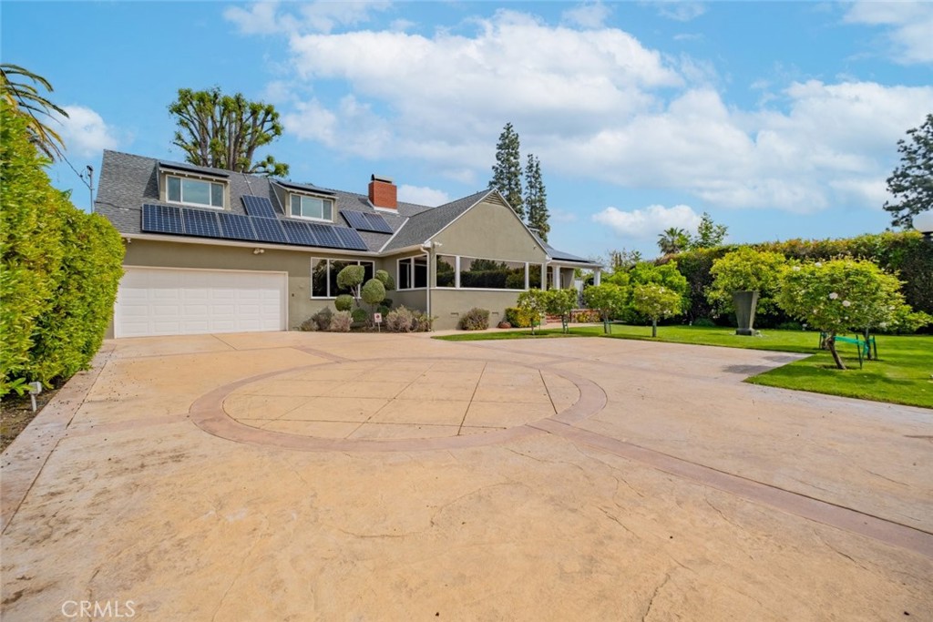 15363 Victory Boulevard Van Nuys, CA 91406 - Photo 3 of 52 a front view of a house with a yard