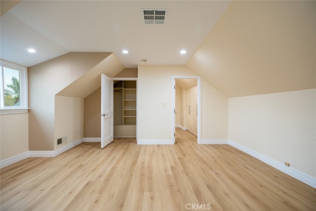 15363 Victory Boulevard Van Nuys, CA 91406 - Photo 31 of 52 an empty room with wooden floor and windows