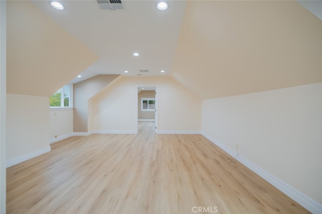 15363 Victory Boulevard Van Nuys, CA 91406 - Photo 34 of 52 an empty room with wooden floor and windows