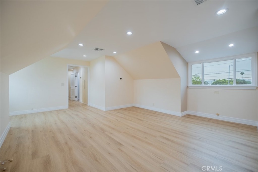 15363 Victory Boulevard Van Nuys, CA 91406 - Photo 35 of 52 a view of an empty room with wooden floor
